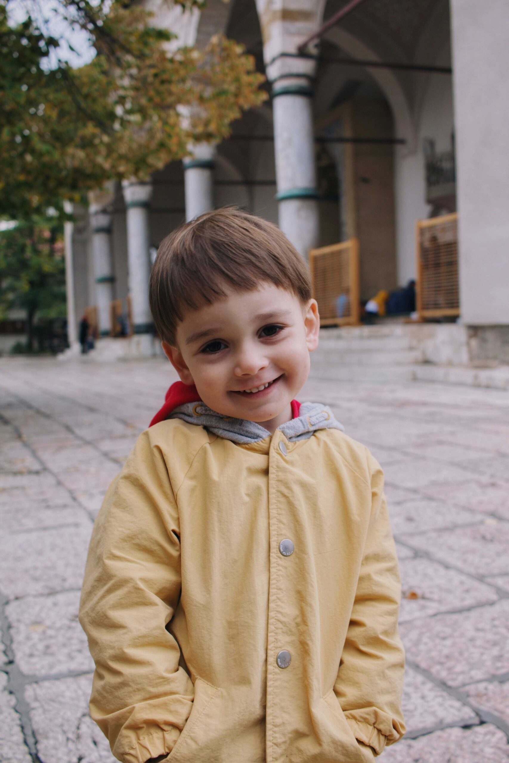 therapy for mom burnout.  adorable preschooler in raincoat