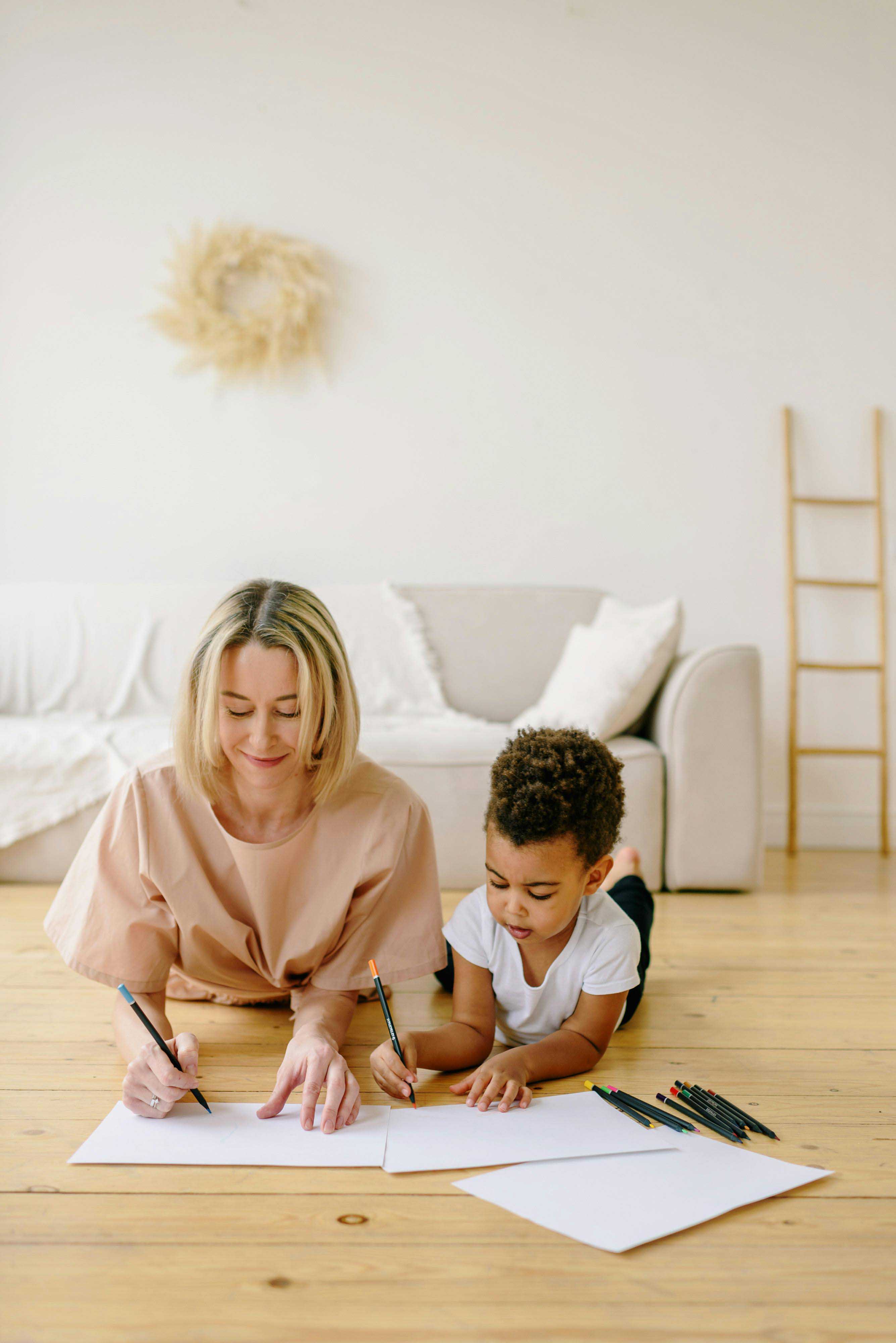 therapy for adhd. blonde mother and young son drawing