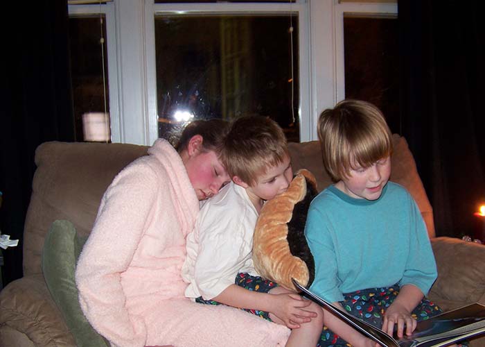 balance self-care holiday. three kids reading twos the night before christmas