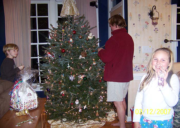 balance self-care holiday.  A family putting up ornaments