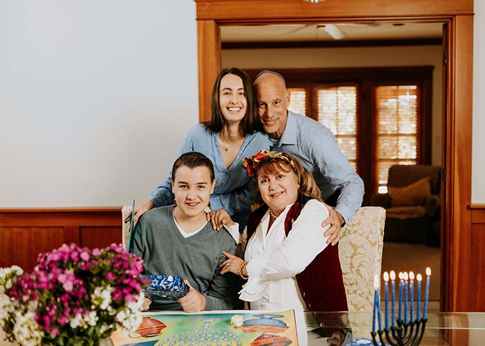 self-care balance holiday jewish family with menorah